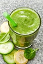 Glass of banana, cucumber and spinach smoothie Royalty Free Stock Photo