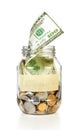 Glass bank for tips with money and put dollars