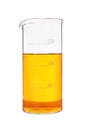 Glass beaker with orange liquid isolated on white Royalty Free Stock Photo