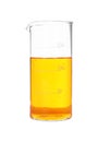 Glass beaker with orange liquid isolated on white Royalty Free Stock Photo