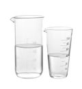 Glass beakers with water on white background