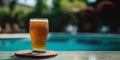 Glass of beer on the background of the pool with copy space, international beer day, AI generated