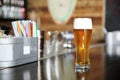 Glass of beer on bar counter in cafe Royalty Free Stock Photo