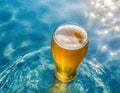 Glass of beer on the beach with crystal clear water and sun rays. Image created by artificial intelligence Royalty Free Stock Photo