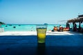 Glass of beer on the beach. Glasses of cold beer and pistachios on wooden table outdoors. Cold beer glass on the bar table at the Royalty Free Stock Photo