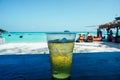 Glass of beer on the beach. Glasses of cold beer and pistachios on wooden table outdoors. Cold beer glass on the bar table at the Royalty Free Stock Photo