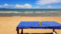Glass of beer on blue table with clear sand, sea and blue sky background at pattaya beach, Thailand. Royalty Free Stock Photo