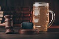 Glass of beer, car keys and wooden gavel. Drinking and driving concept Royalty Free Stock Photo