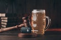 Glass of beer, car keys and wooden gavel. Drinking and driving problem Royalty Free Stock Photo