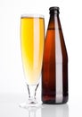 Glass of beer cider with bottle on white Royalty Free Stock Photo