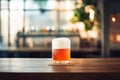 A glass of beer on a coaster on a bar counter with blurred background Royalty Free Stock Photo