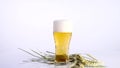 Glass of beer emptying on white background