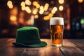 Glass of beer with foam, green leprechaun hat on wooden pub table, Patricks Day Royalty Free Stock Photo