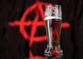 a glass of beer in front a anarchist flag. 3D illustration rendering.