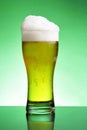 Glass of beer with froth Royalty Free Stock Photo