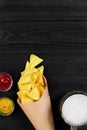 Glass of beer with nachos chips on a wooden background. Royalty Free Stock Photo