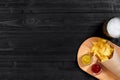 Glass of beer with nachos chips on a wooden background. Royalty Free Stock Photo