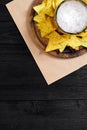 Glass of beer with nachos chips on a wooden background. Royalty Free Stock Photo