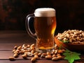 glass of beer with nuts on a wooden table