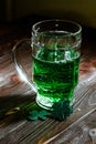 glass of beer at a party where they celebrate St. Patrick's Day. Brewed booze for an outdated Patrick's. Mug Royalty Free Stock Photo