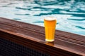 Glass of beer at the pool barside Royalty Free Stock Photo