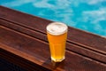 Glass of beer at the pool barside Royalty Free Stock Photo