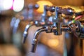 Glass of beer in pub, hand of bartender pouring a large lager beer in tap, the beer taps in a pub Royalty Free Stock Photo