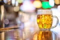 Glass of beer in pub, hand of bartender pouring a large lager beer in tap, the beer taps in a pub Royalty Free Stock Photo