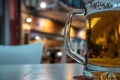 A glass of beer with reflection of street lights