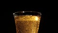 Glass of beer settling