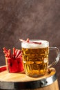 glass of beer with snacks. Dried fish mix on wood plate. dried fish chorizo sausage meat carpaccio Royalty Free Stock Photo