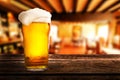 Glass of beer on a table in a pub Royalty Free Stock Photo