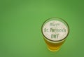 Glass of beer with the text Happy St Patricks dey in the foam Royalty Free Stock Photo