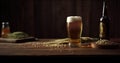 Glass of beer and wheat ears on a wooden table. Dark background. Royalty Free Stock Photo