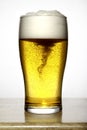 Glass of beer with white foam Royalty Free Stock Photo