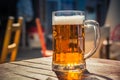 Glass of beer on a wood table Royalty Free Stock Photo