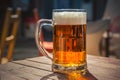 Glass of beer on a wood table. Royalty Free Stock Photo