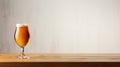 Glass of beer on wooden table over wooden wall background with copy space Royalty Free Stock Photo