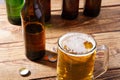 Glass of beer on wooden table, top view. Beer bottles. Selective focus. Mock up. Copy space.Template. Blank.