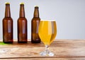 Glass of beer on wooden table, top view. Beer bottles. Selective focus. Mock up. Copy space.Template. Blank.