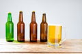 Glass of beer on wooden table, top view. Beer bottles. Selective focus. Mock up. Copy space.Template. Blank.