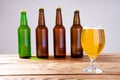 Glass of beer on wooden table, top view. Beer bottles. Selective focus. Mock up. Copy space.Template. Blank.