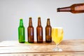 Glass of beer on wooden table, top view. Beer bottles. Selective focus. Mock up. Copy space.Template. Blank.