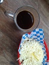 A glass of black coffee and a plate of cheese Royalty Free Stock Photo