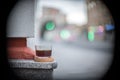 Glass with black filter coffee on the city street bokeh marble coffeebreak