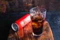 Glass of black soft drinks  and cans of soft drinks Royalty Free Stock Photo