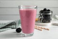 Glass of blackberry smoothie on white table Royalty Free Stock Photo