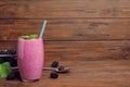 Glass of blackberry smoothie on wooden table. Royalty Free Stock Photo