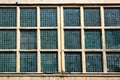 Glass blocks windows in an abandoned industrial building Royalty Free Stock Photo