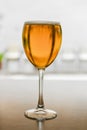 Glass of blond beer, on a table outside. Royalty Free Stock Photo